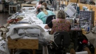 Employees sew fabric at a facility in Hickory, North Carolina. Photographer: Logan Cyrus/Bloomberg