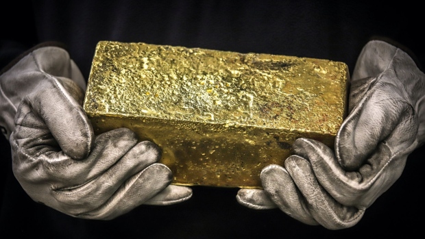 A Twenty kilogram gold brick is handled by a worker at the ABC Refinery smelter in Sydney, New South Wales, Australia, on Thursday, July 2, 2020. Western investors piling into gold in the pandemic are more than making up for a collapse in demand for physical metal from traditional retail buyers in China and India, helping push prices to an eight-year high. Photographer: David Gray/Bloomberg