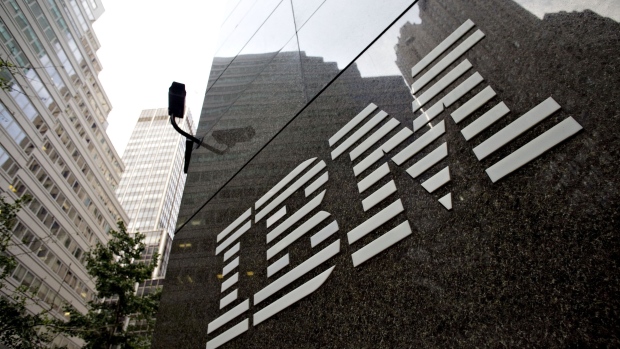 A logo hangs outside the International Business Machines Corp. (IBM) offices at 590 Madison Avenue in New York, U.S., on Thursday, July 16, 2009. Photographer: DANIEL ACKER