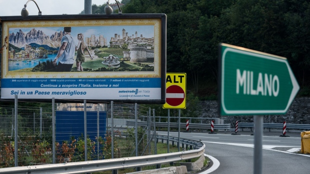 A billboard displays an advertisement for a rest area operated by Autostrade per l'Italia SpA, on the A7 Highway near Genoa, Italy, on Friday, Aug. 24, 2018. Italy's Deputy Prime Minister Matteo Salvini signaled support for a political compromise taking shape following last week's Genoa bridge collapse, saying he favored a government ownership role in toll-road operator Autostrade per l’Italia, but opposed nationalizing the highway network. Photographer: Federico Bernini/Bloomberg