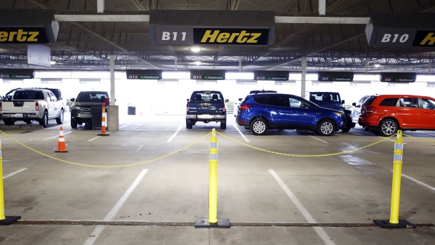 Vehicles sit parked at a Hertz Global Holdings Inc. rental location at Blue Grass Airport in Lexington, Kentucky.