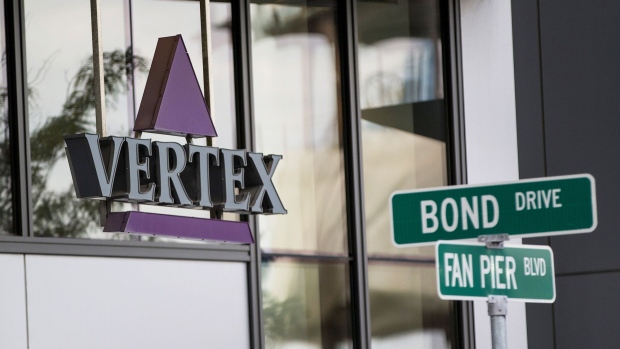 Vertex Pharmaceuticals Inc. signage is displayed at the entrance to the company's building in Boston, Massachusetts, U.S., on Wednesday, Oct. 19, 2016. Vertex Pharmaceuticals will receive an upfront payment of $75 million and additional payments of up to $6 million a year for the development of new cystic fibrosis medicines under an amended research agreement with the Cystic Fibrosis Foundation. Photographer: Scott Eisen/Bloomberg