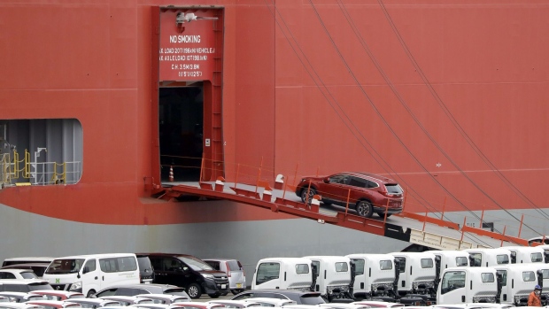 A Honda Motor Co. CR-V sports utility vehicle (SUV) bound for shipment is driven onto the Polaris Highway vehicle carrier, operated by Kawasaki Kisen Kaisha Ltd., at a port in Yokohama, Kanagawa Prefecture, Japan, on Monday, March 30, 2020. Economists are slashing forecasts for the Japanese economy as exports are hit from overseas lockdowns and rising domestic virus cases force the Tokyo governor to request residents to stay home.