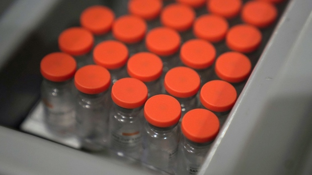 A tray with vials of the Sinovac Biotech Ltd. Covid-19 vaccine during a vaccination at Tanah Abang market in Jakarta, Indonesia, on Wednesday, Feb. 17, 2021. President Joko Widodo seeks to inoculate more than 180 million people to reach herd immunity by the end of the year, a plan that’s been hampered by the limited supply of vaccines globally. Photographer: Dimas Ardian/Bloomberg