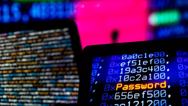 Computer code and text displayed on computer screens.