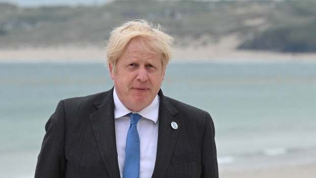 CARBIS BAY, CORNWALL - JUNE 11: Prime Minister of United Kingdom, Boris Johnson, and US President Joe Biden pose during the Leaders official welcome and family photo during the G7 Summit In Carbis Bay, on June 11, 2021 in Carbis Bay, Cornwall. UK Prime Minister, Boris Johnson, hosts leaders from the USA, Japan, Germany, France, Italy and Canada at the G7 Summit. This year the UK has invited India, South Africa, and South Korea to attend the Leaders' Summit as guest countries as well as the EU. (Photo by Leon Neal - WPA Pool/Getty Images)