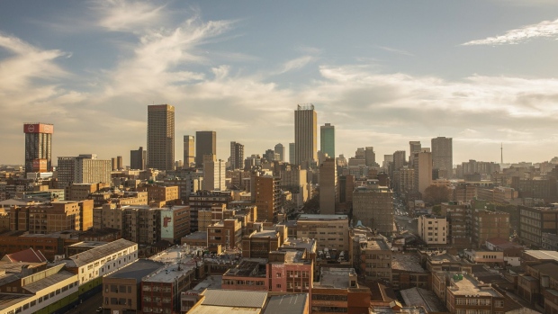 Commercial properties, residential buildings and skyscraper offices on the skyline viewed from a rooftop bar in Johannesburg, South Africa, on Thursday, May 21, 2021. Traders raised bets that South Africa’s central bank will tighten policy this year after inflation accelerated more than expected, resulting in a negative real interest rate for the first time in more than five years.