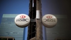 HSBC Holdings Plc signage hangs outside a bank branch in the financial district of Toronto, Ontario, Canada, on Thursday, July 25, 2019. Canadian stocks fell as tech heavyweight Shopify Inc. weighed on the benchmark and investors continued to flee pot companies. Photographer: Brent Lewin/Bloomberg
