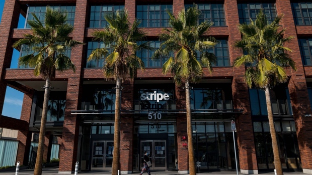 A pedestrian wearing a protective mask walks past Stripe Inc. headquarters in San Francisco, California, U.S., on Thursday, Dec. 3, 2020. Stripe will team up with some of the world's largest banks to offer checking accounts to businesses that sell their wares on e-commerce platforms such as Shopify Inc.