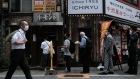 Customers line up in front of a restaurant in the Shinjuku district of Tokyo, Japan, on Friday, May 28, 2021. The Japanese government recommended extending a state of emergency that includes Tokyo and other major cities, trying to rein in coronavirus infections ahead of the capital hosting the Olympics in less than two months. Photographer: Soichiro Koriyama/Bloomberg
