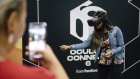 An attendee uses a hand tracking feature with the Oculus VR Quest virtual reality headset in 2019.