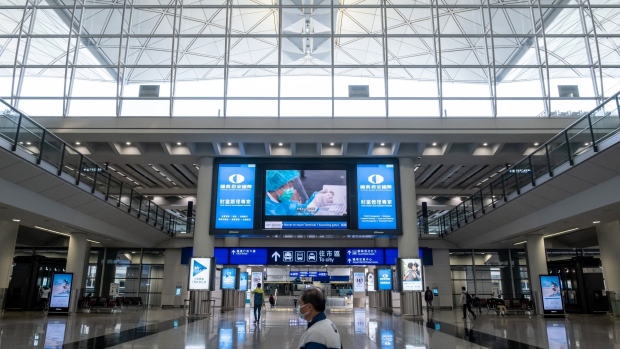 The arrival hall at the Hong Kong International Airport. Photographer: Paul Yeung/Bloomberg