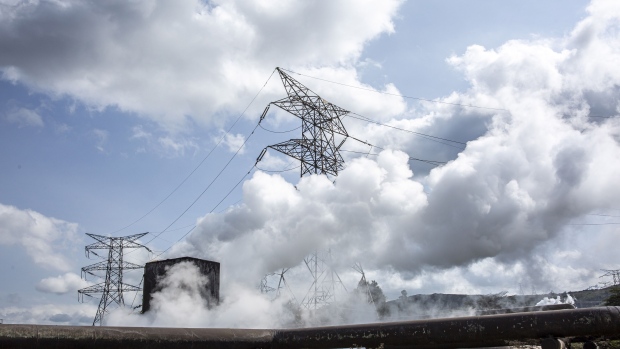 Steam rises next to a high voltage power line inside Hells Gate National Park in Naivaisha, Kenya, on Tuesday, May 18, 2021. Photographer: Patrick Meinhardt/Bloomberg