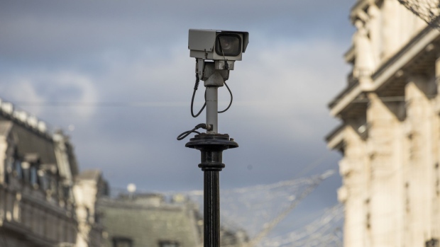 A security camera sits on a pole in central London, U.K. on Monday, Jan. 6, 2020. The Precision Economy is "a future of hyper-surveillance", where technological progress is moderate, but a proliferation of sensors allows firms to create value by capturing and analyzing more information on objects, people and the environment, according to the U.K.’s Royal Society for the encouragement of Arts, Manufactures and Commerce.