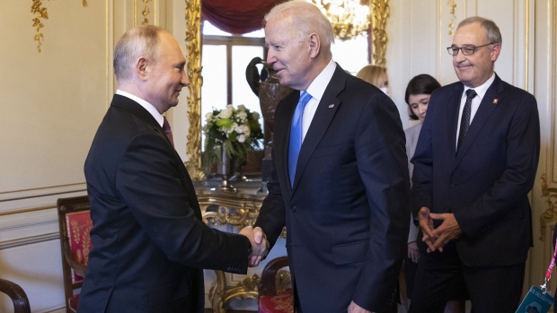 Vladimir Putin and Joe Biden shake hands during the U.S.-Russia summit at Villa La Grange in Geneva on June 16. Photographer: Peter Klaunzer/Keystone/Getty Images