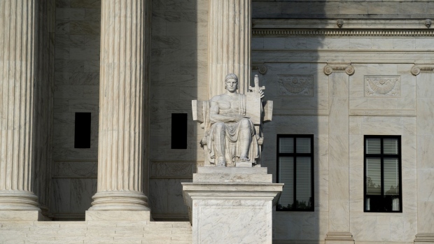 The Authority of Law statue outside the U.S. Supreme Court in Washington, D.C., U.S., on Sunday, June 20, 2021. The White House on Friday reiterated opposition to indexing the gasoline tax to inflation to help pay for an infrastructure plan, raising new questions about the viability of a bipartisan compromise emerging in the Senate. Photographer: Stefani Reynolds/Bloomberg