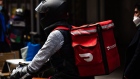 A demonstrator wearing a Doordash backpack in Times Square during a march for food delivery workers rights in New York, U.S., on Wednesday, April 21, 2021. Delivery workers are calling on the city to grant them further labor protections, including enhanced safety provisions, access to bathrooms, and more regulation of the apps, Gothamist reports. Photographer: Paul Frangipane/Bloomberg