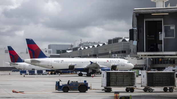 Passenger aircraft operated by Delta Air Lines Inc. at Miami International Airport in Miami, Florida, U.S., on Wednesday, June 16, 2021. Daily U.S. air travelers exceeded 2 million for the first time since the coronavirus pandemic began, reaching almost three-quarters of the volume recorded on the same day in 2019, according to the Transportation Security Administration. Photographer: Eva Marie Uzcategui/Bloomberg