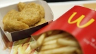 A box of chicken nuggets, left, sits beside a portion of french fries in this arranged photograph at a McDonald's restaurant, operated by McDonald's Holdings Co. Japan Ltd., in Tokyo, Japan, on Wednesday, Jan.7, 2015.