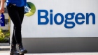 Pedestrians walk past Biogen Inc. headquarters in Cambridge, Massachusetts, on June 7, 2021.