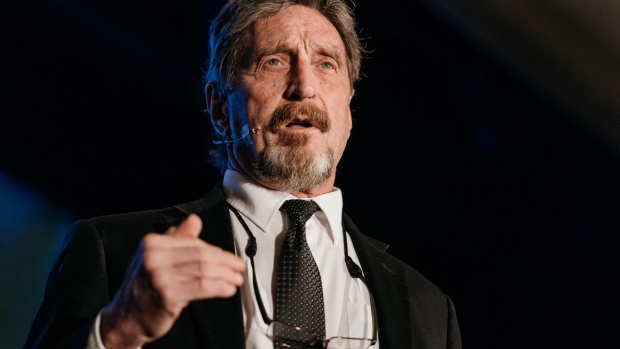 John McAfee, founder of McAfee Associates Inc. and chief cybersecurity visionary at MGT Capital Investments Inc., speaks at the Shape the Future: Blockchain Global Summit in Hong Kong, China, on Wednesday, Sept. 20, 2017