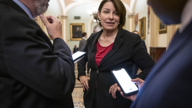 Senator Amy Klobuchar, a Democrat from Minnesota, speaks to members of the media outside the Senate Chamber during a vote in Washington, D.C., U.S., on Thursday, June 17, 2021. Members of the bipartisan Senate group behind a compromise $579 billion infrastructure plan say more lawmakers are lining up in support, offering a glimmer of hope that it could draw enough votes to pass the Senate.