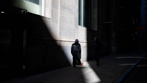 A pedestrian walks through the Financial District of New York, U.S., on Friday, March 5, 2021. Stocks climbed as technology shares rebounded from an earlier selloff. Photographer: Michael Nagle/Bloomberg