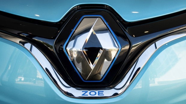 A badge on a Renault Zoe R135 electric automobile inside a Renault SA showroom in Paris, France, on Wednesday, June 9, 2021. The manufacturer announced on Wednesday the creation of ElectriCity, a wholly owned unit that combines operations at three sites in Douai, Maubeuge and Ruitz and will aim to produce as many as 400,000 vehicles annually. Photographer: Benjamin Girette/Bloomberg