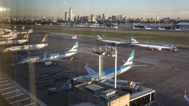 Boeing Co. aircraft, operated by Aerolineas Argentina SA, stand at Aeroparque in Buenoes Aires, Argentina, on Monday, May 18, 2020. In Argentina, home to the strictest travel ban in the Americas with flights grounded until Sept. 1, state-run carriers Aerolineas Argentinas and Austral Lineas Aereas are merging to survive.