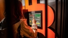 A customer uses a bitcoin automated teller machine (ATM) in a kiosk Barcelona, Spain, on Tuesday, Feb. 23, 2021.
