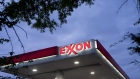 Signage is displayed at an Exxon gas station in Falls Church, Virginia.
