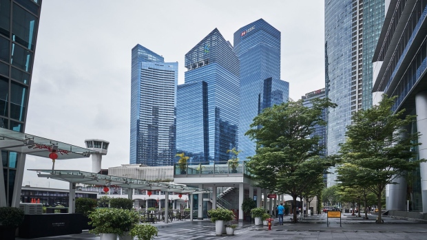 Towers that house the HSBC Holdings Plc headquarters, center right, the Standard Chartered Plc headquarters, center left, and other banks and financial institutions in the central business district (CBD) of Singapore, on Thursday, Jan. 28, 2021. HSBC plans to accelerate its expansion across Asia in its imminent strategy refresh, Chairman Mark Tucker told the virtual Asian Financial Forum last week.