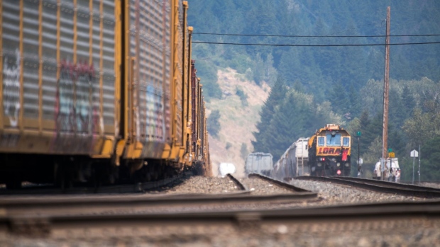 Rail cars in the Fraser River Valley south of Lytton, British Columbia, Canada, on Saturday, July 3, 2021. A protracted heat wave continues to fuel scores of wildfires in Canada's western provinces, with Prime Minister Justin Trudeau calling an emergency meeting of a cabinet crisis group to address the matter. Photographer: James MacDonald/Bloomberg