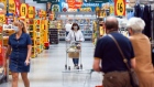 Customers move through a Morrisons supermarket, operated by Wm Morrison Supermarkets Plc, in Saint Ives, U.K., on Monday, July 5, 2021. Apollo Global Management Inc. said Monday it's considering an offer for Morrison, heating up a takeover battle for the U.K. grocer.