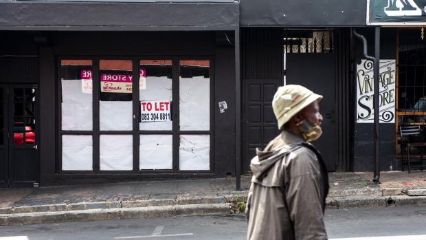A 'To Let' sign on the window of a closed store on 7th Street in the Mellville district of Johannesburg, South Africa, on Thursday, Nov. 12, 2020. Jobs were at the center of a post-virus reconstruction and recovery plan presented by President Cyril Ramaphosa last month, with the government committing 100 billion rand ($6.37 billion) to create public and social employment opportunities.