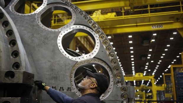 A worker stands on the assembly line for gas turbines at the GE plant in Greenville, South Carolina.