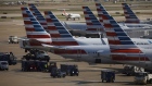 American Airlines Group Inc. airplanes stand at passenger gates at Dallas/Fort Worth International Airport (DFW) near Dallas, Texas. Photographer: Patrick T. Fallon/Bloomberg
