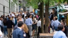 People wait in line at food trucks the Goldman Sachs headquarters building in New York, U.S., on Monday, June 14, 2021. Goldman Sachs Group Inc. is bringing thousands of employees back to the office across the U.S. Monday for the first time in more than a year. Photographer: Michael Nagle/Bloomberg