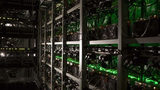 Cryptocurrency mining rigs operate in a cargo container at the Golden Fleece cryptocurrency mining company in Kutaisi, Georgia, on Monday, Jan. 22, 2018. Golden Fleece uses a cargo container with Chinese-built computers inside a dilapidated Soviet-era tractor factory to extract cryptocurrencies using low-cost electricity generated by water flowing from the nearby Caucasus Mountains. Photographer: Daro Sulakauri/Bloomberg