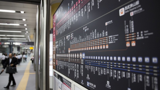 A route map for the Toyoko line, operated by Tokyu Corp., top, and Fukutoshin line, operated by Tokyo Metro Co., is displayed at Shibuya Station in Tokyo, Japan, on Tuesday, July 18, 2017. July 24 marks the first dry run of a 'Telework Day' encouraging people to work from home as the city gears up to host the 2020 Summer Olympics. Authorities are seeking ways to make room for 920,000 spectators expected to visit Tokyo each day during the games. Photographer: Tomohiro Ohsumi/Bloomberg