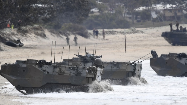 BOWEN, AUSTRALIA - JULY 22: Japanese AAVs (Assault Amphibious Vehicle) come ashore in a beach landing on July 22, 2019 in Bowen, Australia. Exercise Talisman Sabre 2019 is the largest exercise that the Australian Defence Force (ADF) conducts with all four services of the United States armed forces. The biennial exercise focuses on crisis action planning and humanitarian missions, enhancing participating nations' capabilities to deal with regional contingencies and terrorism. It is the first time the NZDF has been invited to participate fully, with NZDF personnel to be working as part of a large force led by the Australians and NZDF military assets will be integrated with those of the ADF and the US armed forces. (Photo by Ian Hitchcock/Getty Images)