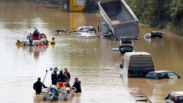 Rescue teams look for victims on a flooded highway in Erftstadt, Germany, on Saturday, July 17, 2021. The death toll from the floods that devastated parts of western Germany rose to at least 103, with scores of people injured and many others unaccounted for after houses were swept away and roads and bridges were badly damaged.