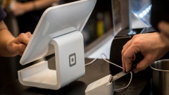 A customer inserts a credit card into Square Inc. device while making a payment in San Francisco, California, U.S., on Tuesday, March 27, 2018. The mobile payment market is anticipated to grow reaching a market value of $4,574 billion by 2023, according to data provided by Allied Market Research (AMR). The growth projections are attributed to an increasing demand for hassle-free purchase of goods and services, as well as an increased preference of consumers toward digital and cashless payments. Photographer: David Paul Morris/Bloomberg