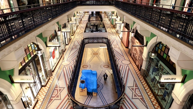 A pedestrian walks through the near empty Queen Victoria Building during a lockdown imposed due to the coronavirus in Sydney, Australia, on Tuesday, June 29, 2021. Close to half of Australia’s population is now in lockdown as the nation struggles to contain a spread of the delta coronavirus variant.