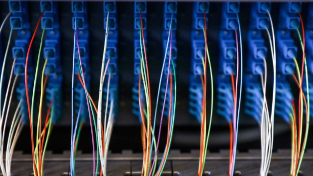 Fiber optic cables in an optical line termination in a Telecom Italia SpA telephone exchange in Rome, Italy, on Monday, May 17, 2021. Telecom Italia report results on Wednesday. Photographer: Alessia Pierdomenico/Bloomberg