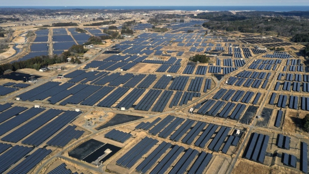 A solar farm's photovoltaic panels stands on former farmland in the Yatsuda district of Namie, Fukushima Prefecture, Japan, on Sunday, March 7, 2021. Laid waste by a nuclear disaster a decade ago, Japan’s Fukushima is still struggling to recover, even as the government tries to bring people and jobs back to former ghost towns by pouring in billions of dollars to decontaminate and rebuild. Photographer: Toru Hanai/Bloomberg