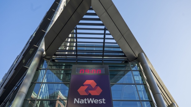 The logo of NatWest Group Plc, stands on display in front of the headquarters of the Royal Bank of Scotland Group Plc in London, U.K. on Monday, Feb. 17, 2020. RBS's new boss Alison Rose is abandoning the bank's three-centuries-old name and renaming the bank NatWest Group Plc later this year. Photographer: Jason Alden/Bloomberg