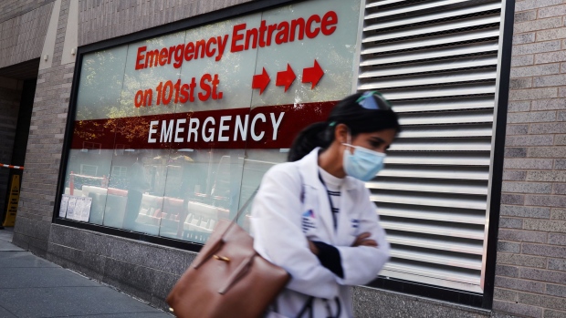 A person walks past an "Emergency Entrance" sign at Mount Sinai Hospital in Manhattan, which has treated hundreds of COVID-19 patients since March, on September 22, 2020 in New York City.