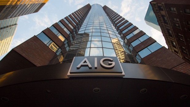 Signage is displayed outside American International Group Inc. (AIG) offices in New York. Photographer: Craig Warga/Bloomberg