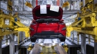 A Hyundai Kona electric sport utility vehicle (SUV) in a cradle on the assembly line at the Hyundai Motor Co. plant in Nosovice, Czech Republic, on Wednesday, April 7, 2021. With Europe expected to lead the world in electric-car sales for a second straight year, an epic rush to build a battery-supply chain from scratch is playing out across the continent.